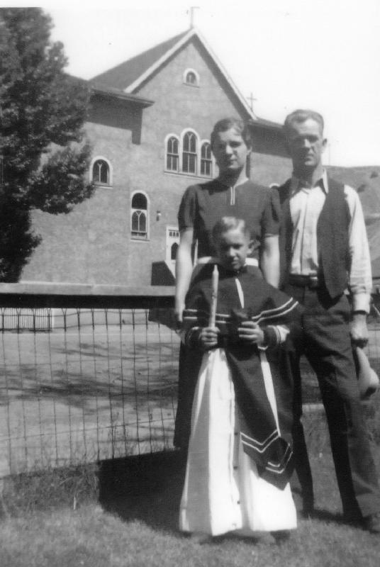 Angelo Bergamo with his parents.jpg - From left to right, Anna Andreoli Bergamo and husband, Arcangelo Bergamo, with son, Angelo Bergamo, after Angelo's first Catholic Communion. Photo was taken in their front yard in Dawson, NM in front of the Dawson Catholic Church.